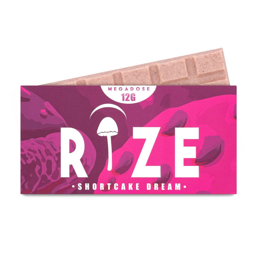 Rize Shortcake Dream 12g Megadose Mushroom Chocolate Bar in branded packaging showing scored white chocolate tiles with strawberry and shortcake pieces