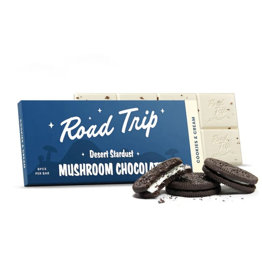 Road Trip mushroom chocolate cookies and cream flavor with chocolate cookies with cream filling resting in front of it 