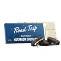 Road Trip mushroom chocolate cookies and cream flavor with chocolate cookies with cream filling resting in front of it 