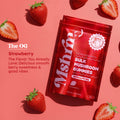 MshrooM FX Extra Strength Bulk Mushroom Gummies Strawberry 50 count red bag flat lay on coral pink background surrounded by fresh whole and sliced strawberries with The OG flavor callout describing delicious smooth berry sweetness and good vibes showing vegan gluten free no high fructose corn syrup badge 21 plus age requirement and 7.1 oz net weight