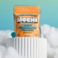 Picture of the packaging for Mochi magic mushroom gummies with a picture of the gummy outside the bag. 